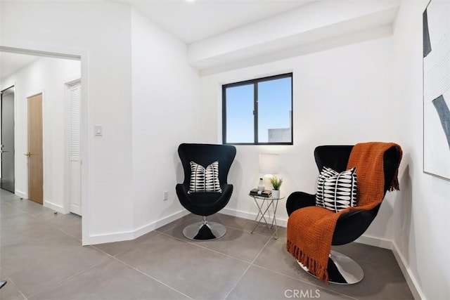 sitting room featuring baseboards