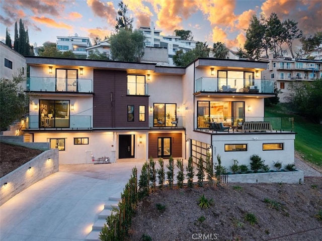 5221 Campo Rd, Woodland Hills, CA 91364 - back of property featuring a balcony and stucco siding