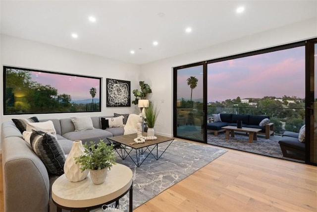 living room with recessed lighting and wood finished floors