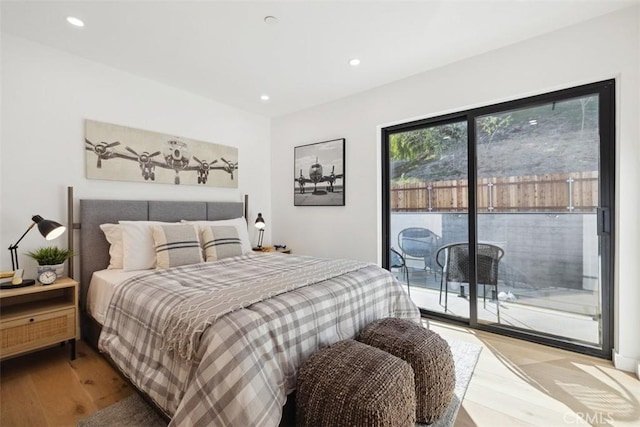 bedroom featuring recessed lighting, light wood-style flooring, and access to exterior