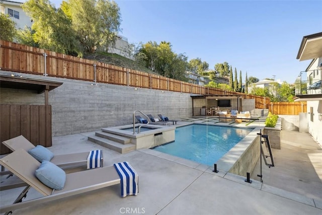 view of pool with outdoor lounge area, a patio, a fenced backyard, and an in ground hot tub