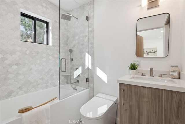 5221 Campo Rd, Woodland Hills, CA 91364 - full bath featuring toilet, vanity, and enclosed tub / shower combo