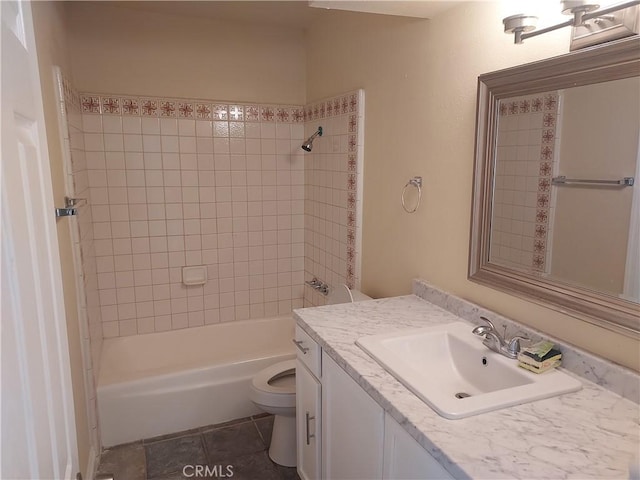 bathroom featuring vanity, shower / bathing tub combination, and toilet