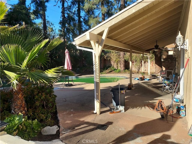 view of patio / terrace with a fenced backyard and ceiling fan