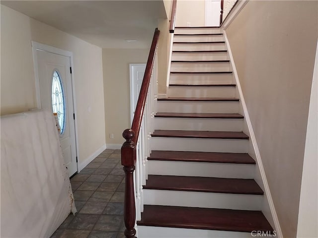 stairway with baseboards