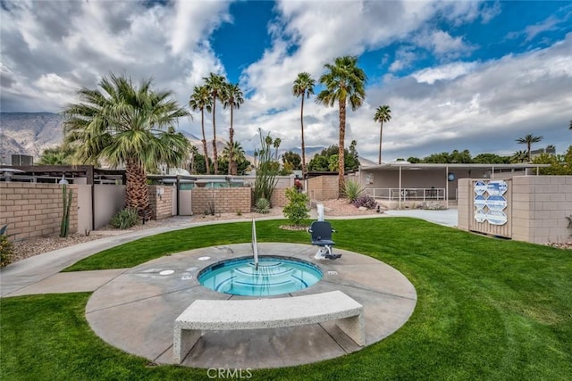 view of pool featuring a yard and fence