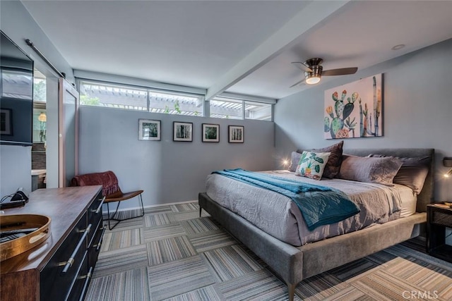 bedroom with carpet flooring, multiple windows, and ceiling fan