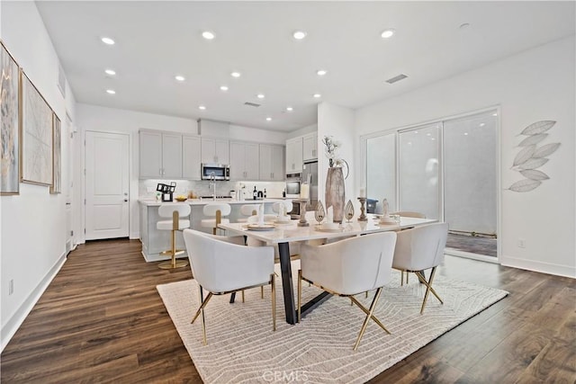392 Baluster, Irvine, CA 92618 - dining space featuring dark wood finished floors, visible vents, recessed lighting, and baseboards