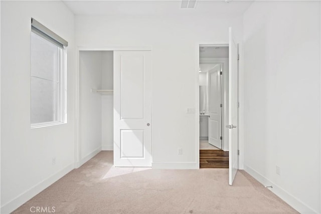392 Baluster, Irvine, CA 92618 - unfurnished bedroom with carpet flooring, baseboards, visible vents, and a closet
