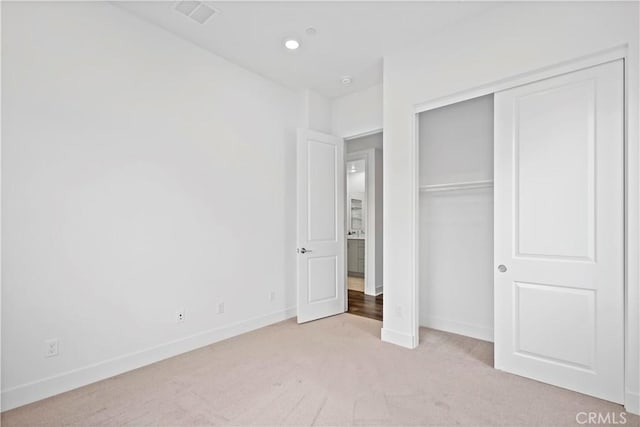 392 Baluster, Irvine, CA 92618 - unfurnished bedroom with light colored carpet, visible vents, a closet, and baseboards