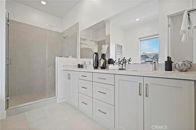 392 Baluster, Irvine, CA 92618 - full bath featuring double vanity, recessed lighting, a stall shower, a sink, and tile patterned flooring
