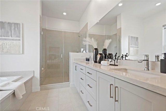 392 Baluster, Irvine, CA 92618 - bathroom with a garden tub, double vanity, a stall shower, tile patterned floors, and a sink