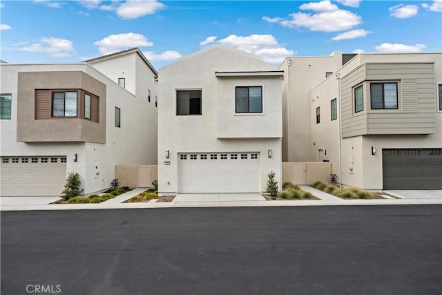 392 Baluster, Irvine, CA 92618 - view of front facade featuring an attached garage, fence, and stucco siding
