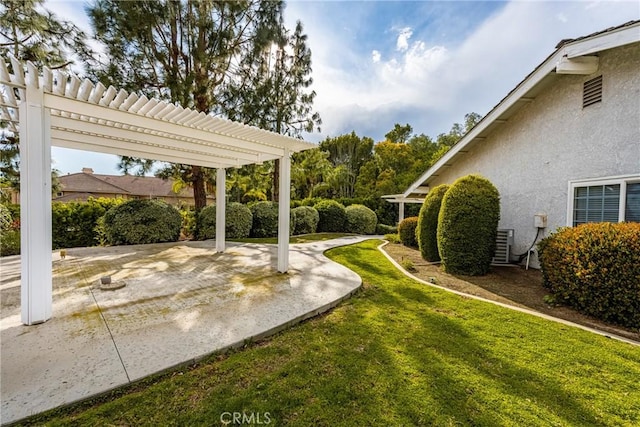 view of yard featuring a patio and a pergola