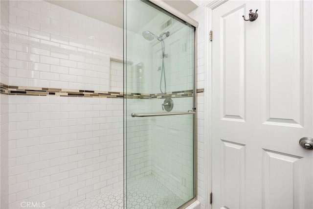 bathroom with a stall shower