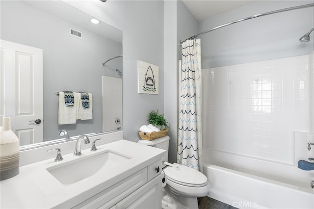 bathroom with visible vents, shower / bath combination with curtain, toilet, and vanity