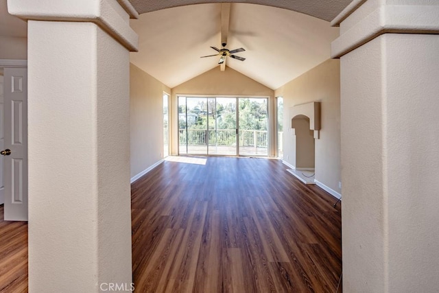 unfurnished living room featuring wood finished floors, baseboards, and ceiling fan