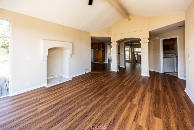 spare room featuring ceiling fan, decorative columns, arched walkways, and plenty of natural light