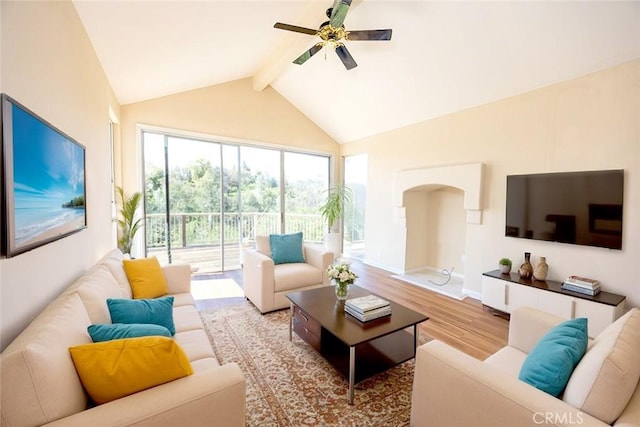 living room with wood finished floors, baseboards, high vaulted ceiling, beam ceiling, and ceiling fan