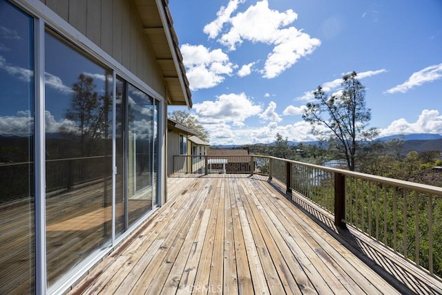 wooden terrace with a mountain view