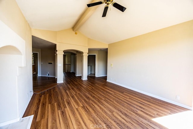 spare room featuring beam ceiling, wood finished floors, decorative columns, baseboards, and ceiling fan