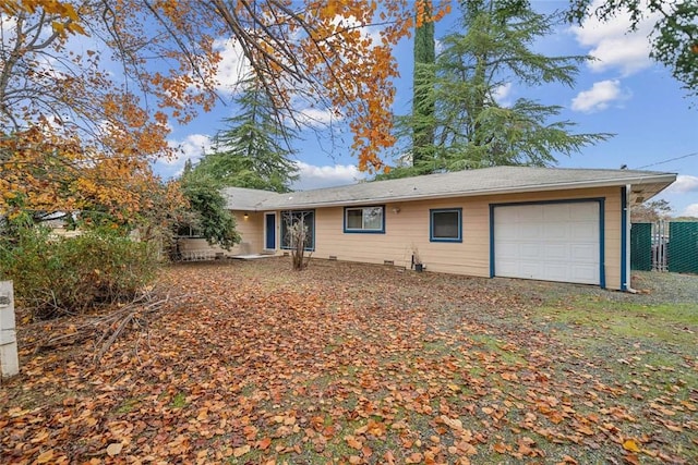 ranch-style house featuring a garage