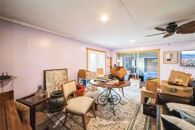 interior space with wood finished floors and ceiling fan