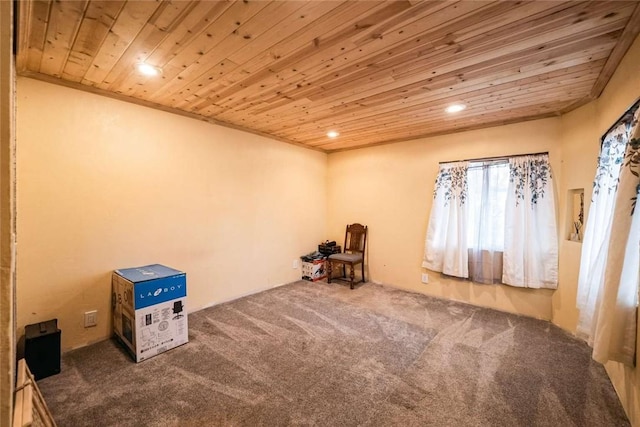 interior space featuring recessed lighting, wooden ceiling, and carpet flooring