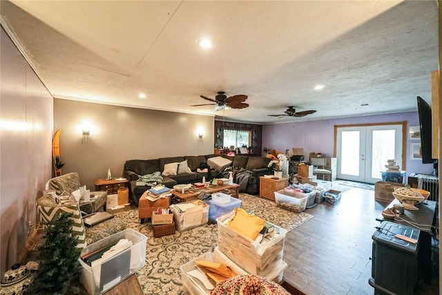 interior space featuring recessed lighting, wood finished floors, french doors, and ceiling fan