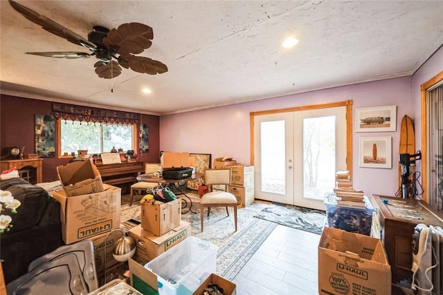 interior space with wood finished floors, recessed lighting, ceiling fan, french doors, and a textured ceiling