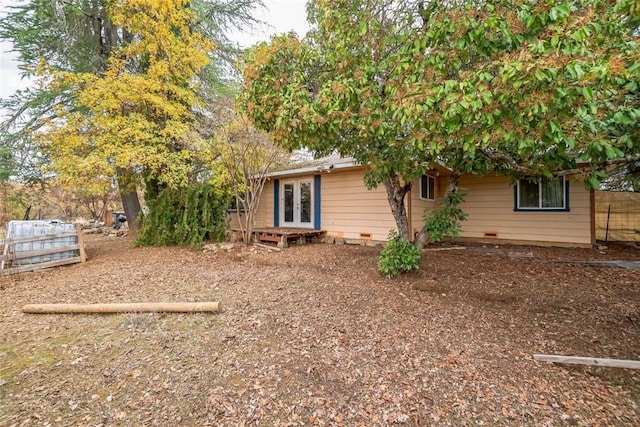 back of property featuring french doors