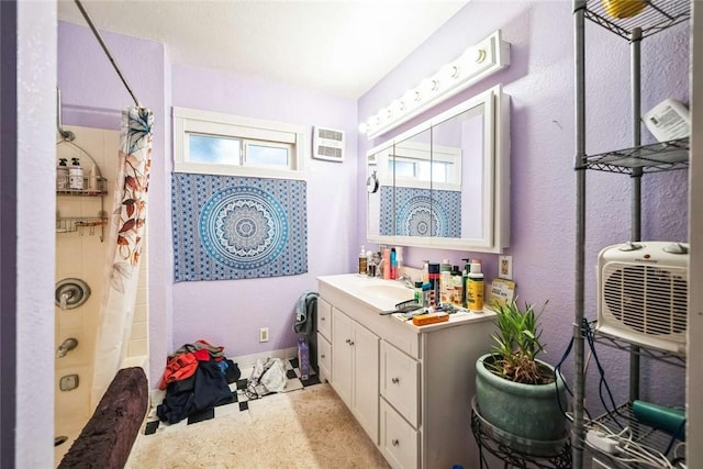 bathroom with vanity and shower / bath combination with curtain