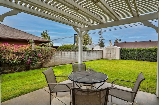 view of patio / terrace featuring a pergola, a fenced backyard, a shed, an outdoor structure, and outdoor dining area