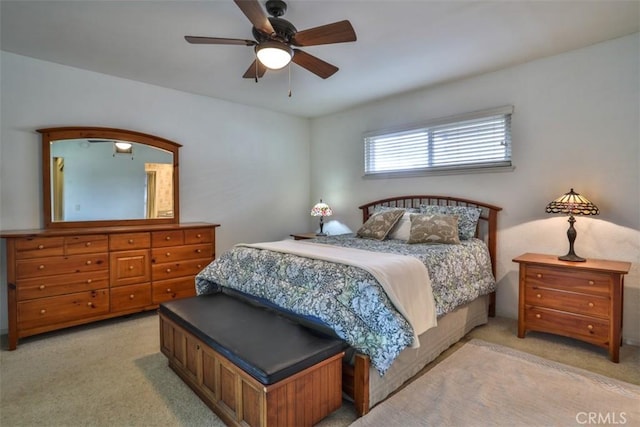 bedroom with light colored carpet and ceiling fan