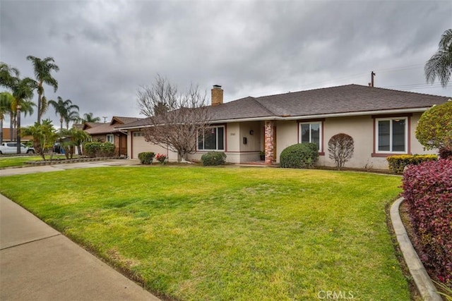 ranch-style home with a front yard, driveway, stucco siding, a chimney, and a garage