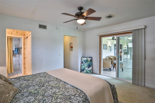 carpeted bedroom with visible vents and ceiling fan