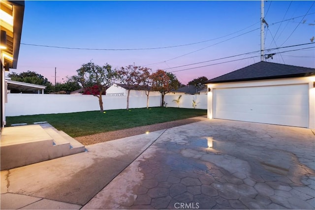 detached garage featuring fence