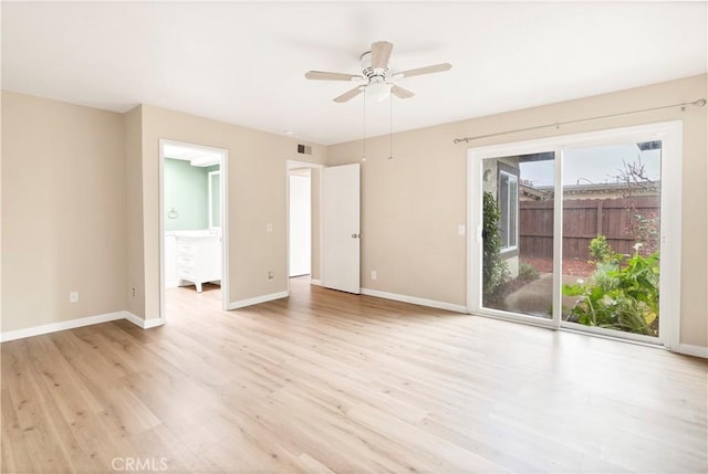 unfurnished room with visible vents, baseboards, light wood-type flooring, and a ceiling fan