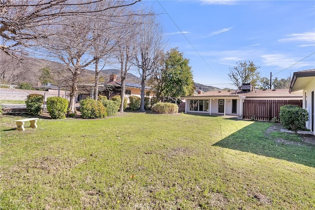 view of yard with fence