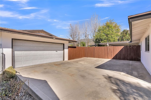 garage with fence