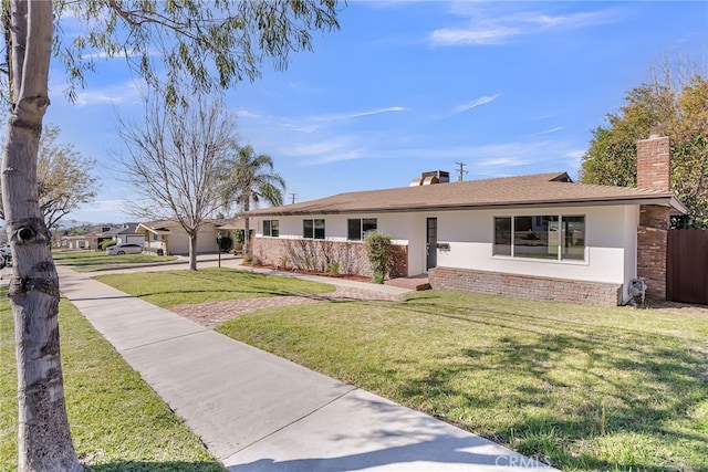 single story home featuring stucco siding, a front yard, a chimney, and fence