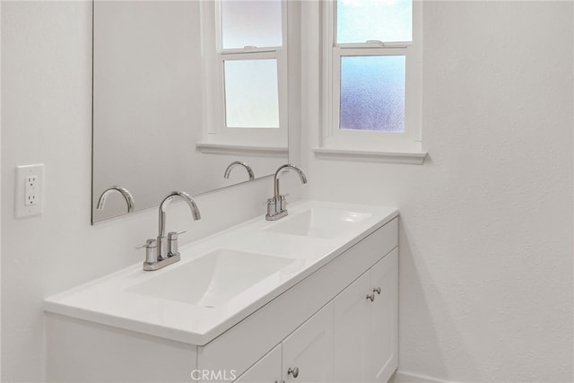 bathroom with double vanity and a sink