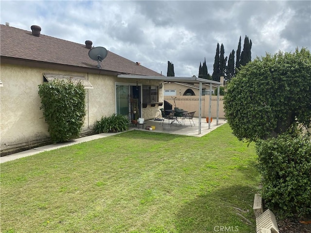 view of yard with fence and a patio area