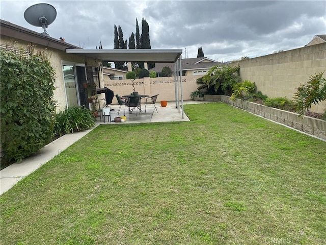 view of yard with a fenced backyard and a patio area