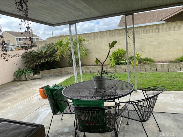 view of patio / terrace featuring outdoor dining area and a fenced backyard