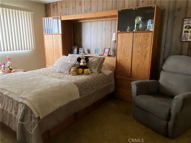 bedroom with wooden walls