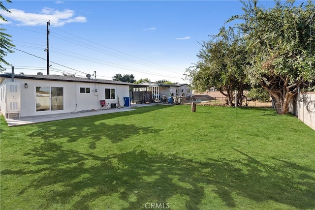 view of yard with a fenced backyard and a patio area