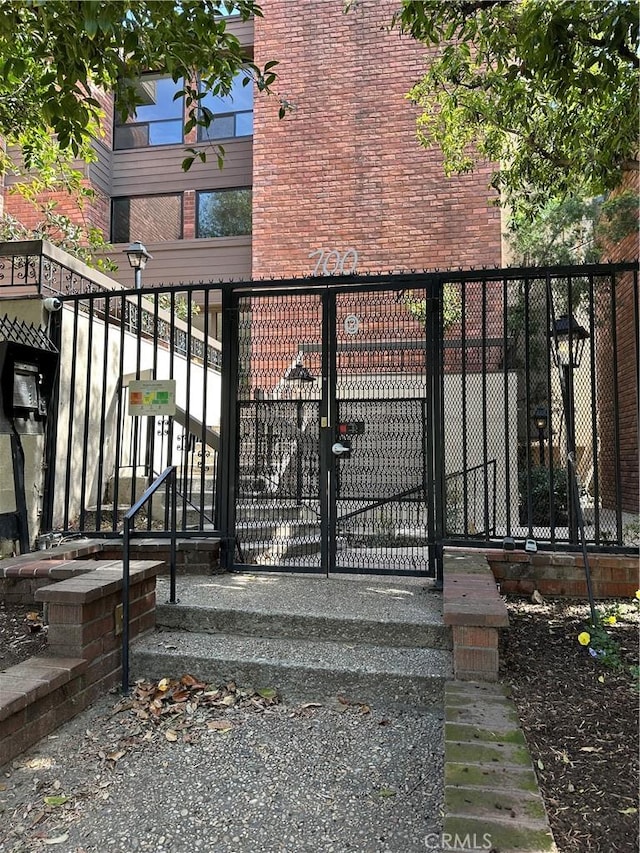 view of gate featuring fence