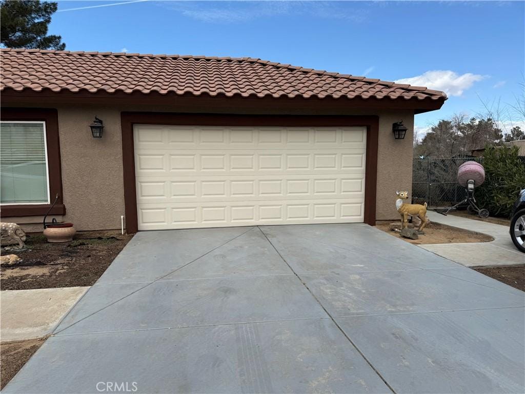 garage with driveway