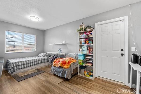 bedroom with wood finished floors